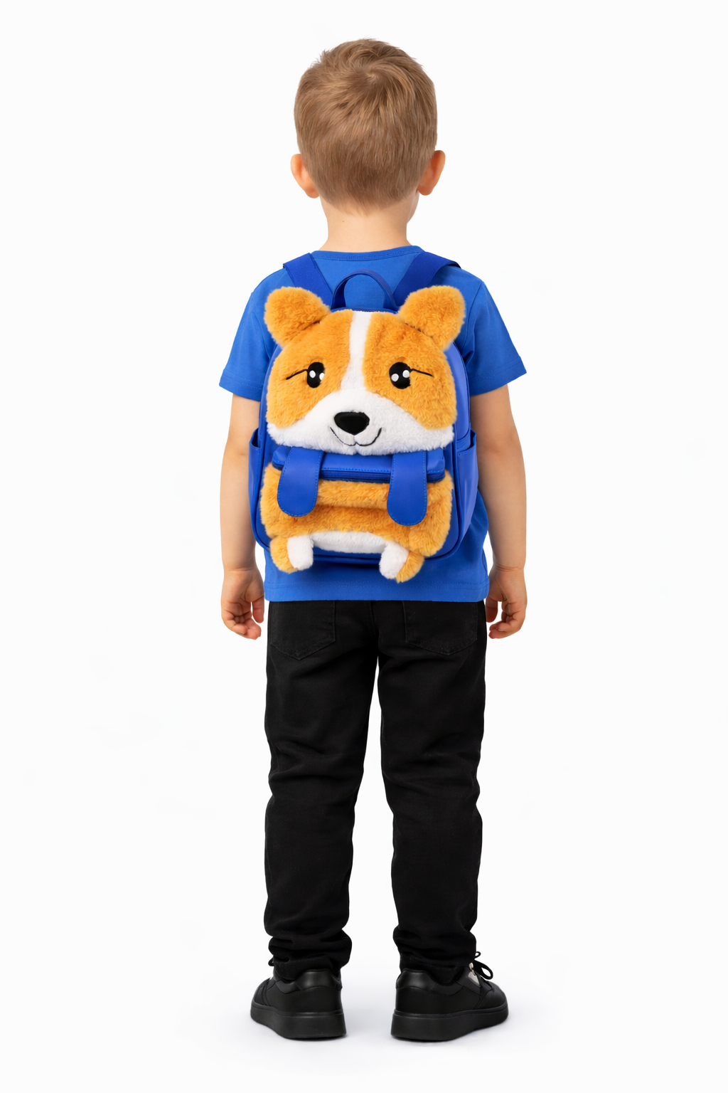 Child wearing a blue shirt with a dog design on the back against a white background